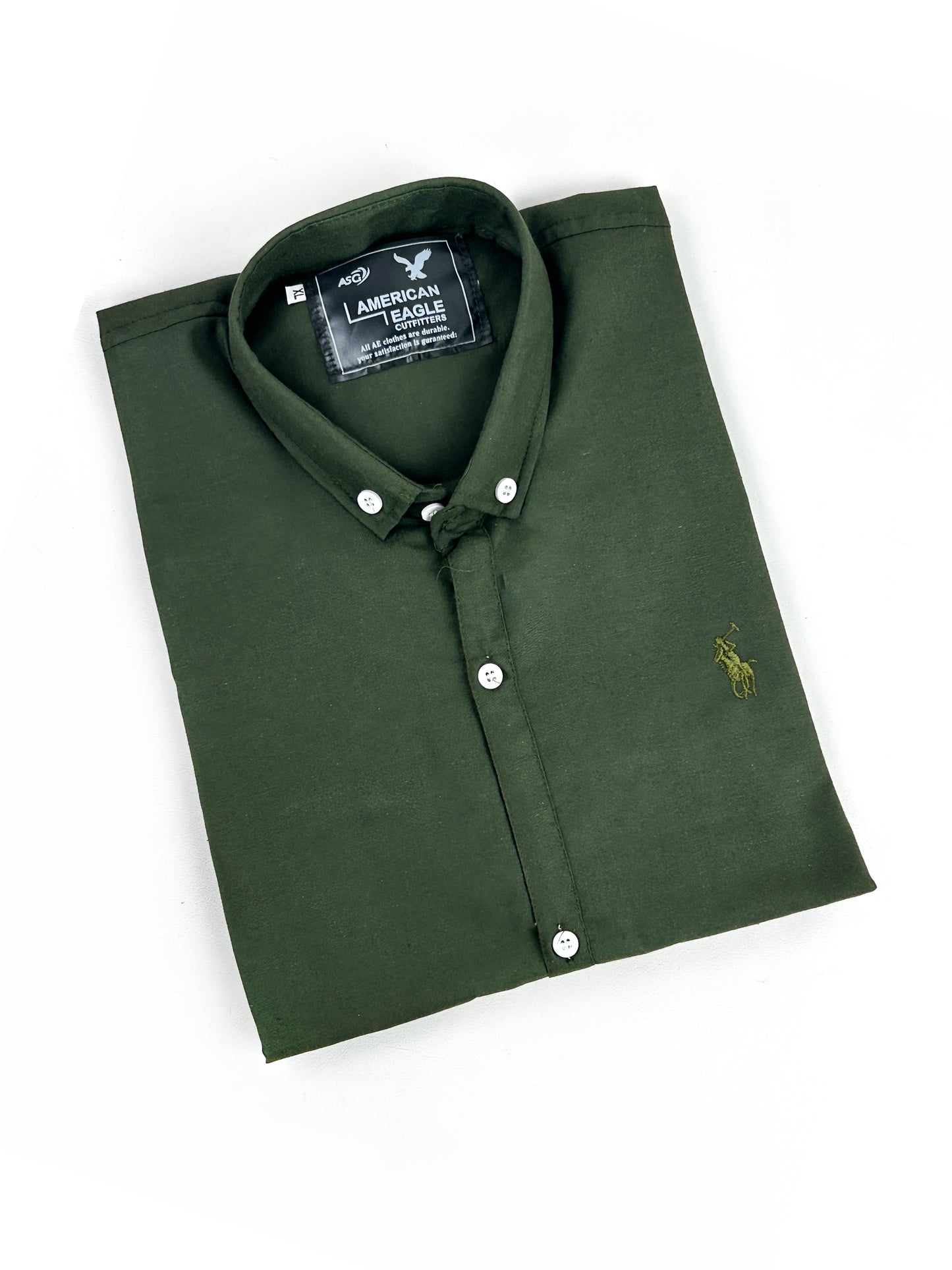 Folded green polo shirt with American Eagle logo on a white background