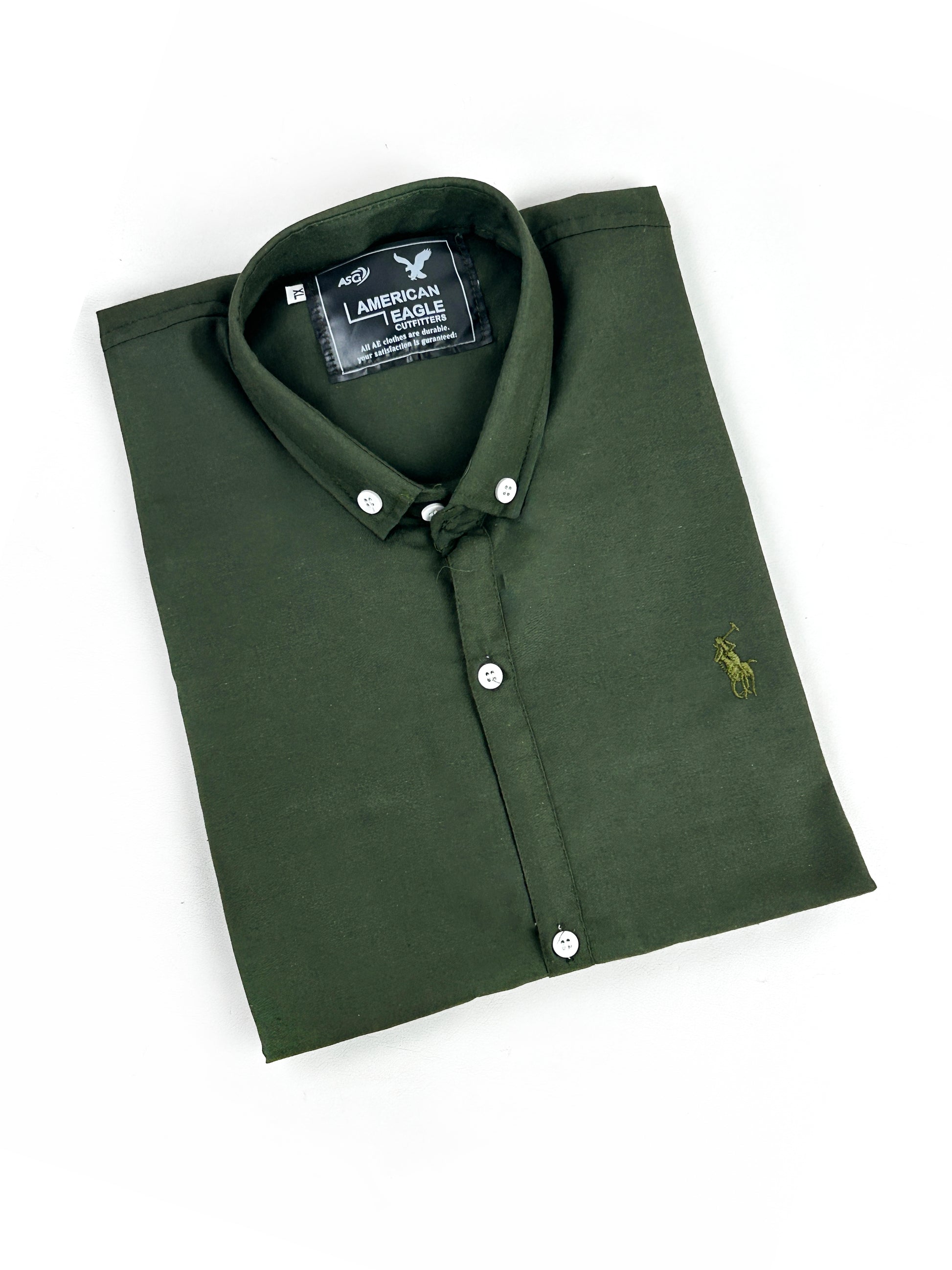 Folded green polo shirt with American Eagle logo on a white background