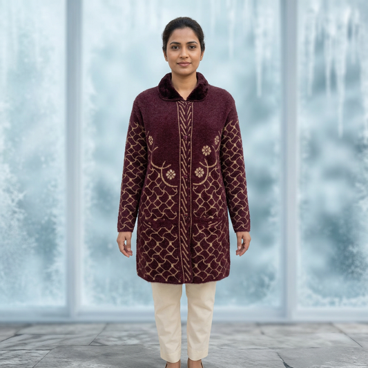 Woman modelling WSW119 maroon full sleeve button-front sweater with gold-toned patterns against a blurred ice-themed background. Trousers are styling only.