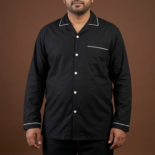 Close product view of MNS21 black night suit with white piping on a Pakistani male model with a fuller build
