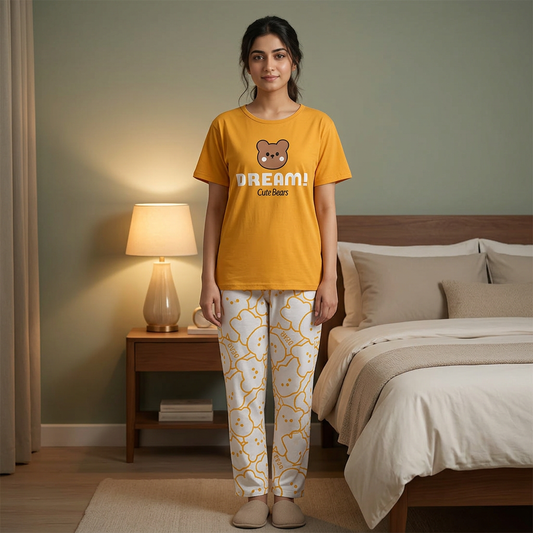 Adult Pakistani woman wearing the Dream Yellow WNS73 bear-print night suit in a relaxed bedtime setting.