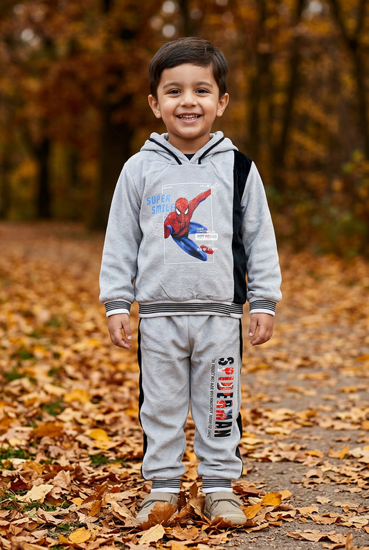 Child wearing BS869 light-grey Blower Velvet character-print hoodie with black panel and striped trims, and matching joggers in an autumn park.