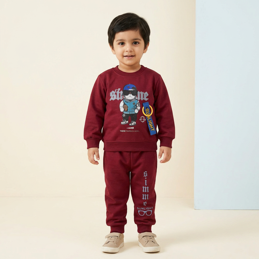 Pakistani child model approximately three years old wearing BS777 red shirt and trouser suit