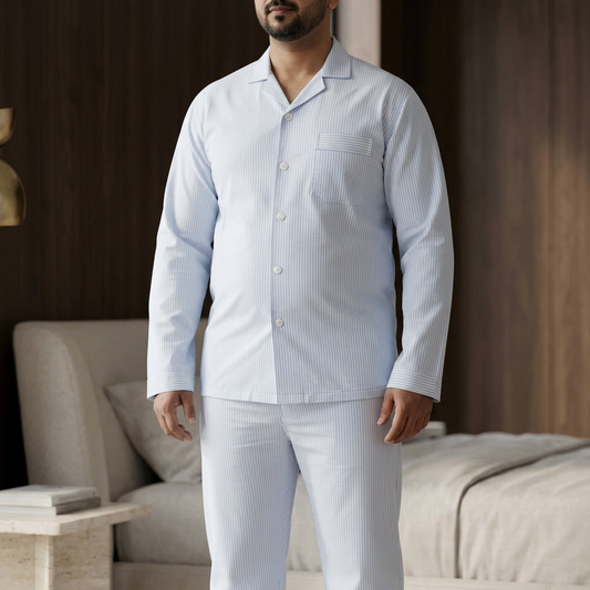 Close-up of Pakistani male model with fuller build wearing MNS26 light blue striped night suit