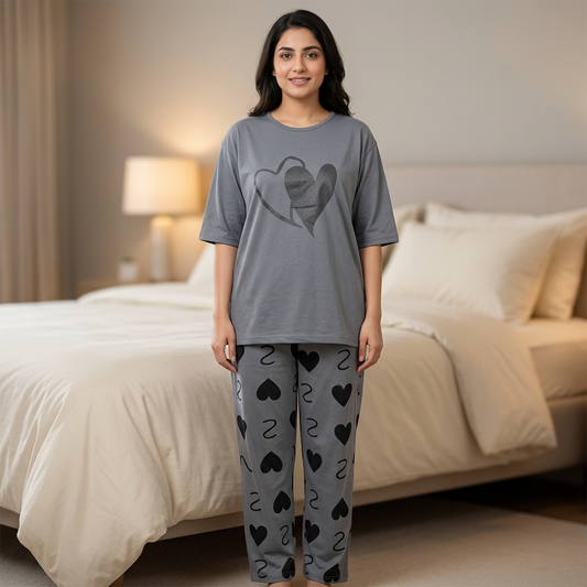 Adult woman wearing WNS79 grey heart-design top and matching heart-print night suit trousers